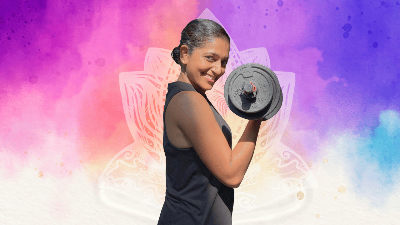 Rashmi Ramesh doing a dumbbell bicep curl for Yogalates Strength Plus, a 10-week online strength training program for women
